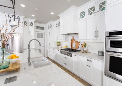 white kitchen with white marble countertops